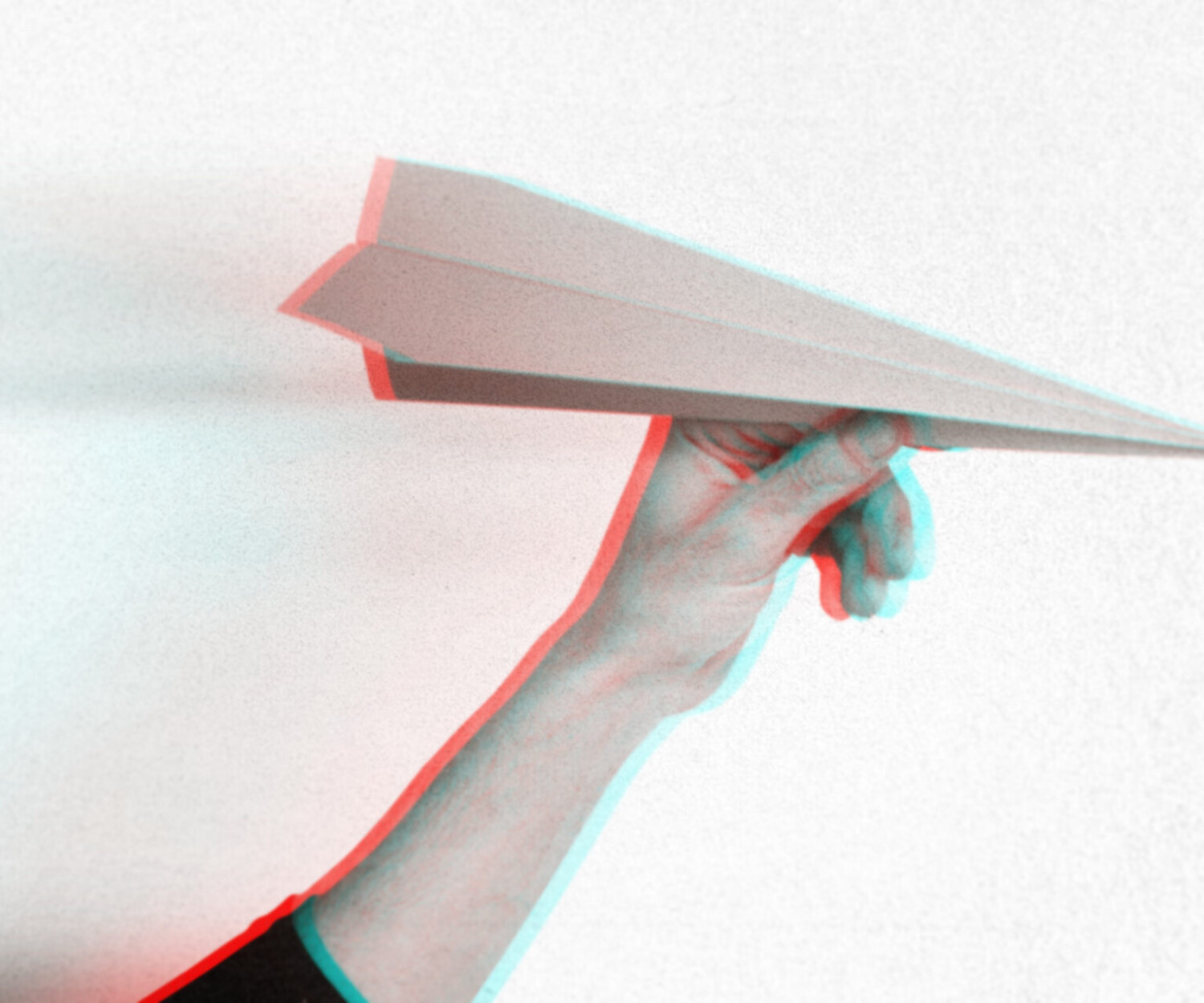 Anaglyph effect on hand holding paper plane